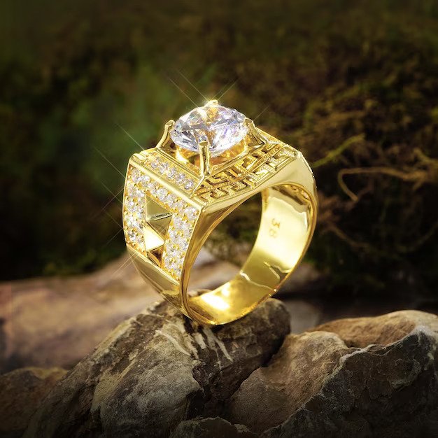 gold-ring-men-with-diamonds-cubic-zirconia-emeralds-precious-stones-background-rock-moss_579873-418